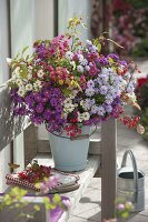 Rural autumn bouquet in enameled bucket