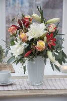 Winter bouquet with Hippeastrum 'White Peacock' 'Hummingbird Red' (amaryllis), pink