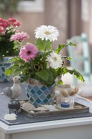 Gerbera pink and white planted together, maritime decorated with shells