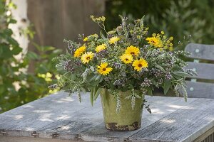 Bouquet of summer flowers and flowering herbs