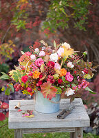 Autumn bouquet of pink (roses, rose hips), Euonymus (peony)