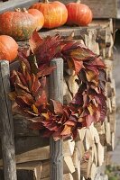 Wreath made of leaves of Prunus (ornamental cherry) at the firewood storehouse