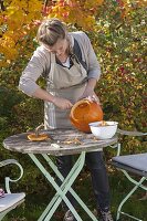 Hollowing out pumpkin for floristry