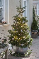 Christmas tree with birds and stars made of birch bark