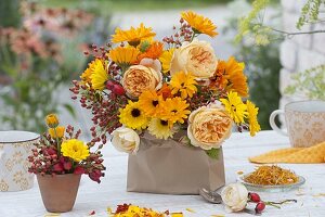 Late summer bouquet of pink (rose), calendula (marigold)