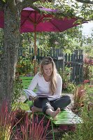 Green Liege with parasol under apple tree