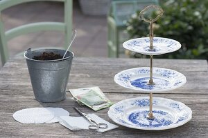 Ceramic etagere with cress and sprouts as edible table decoration