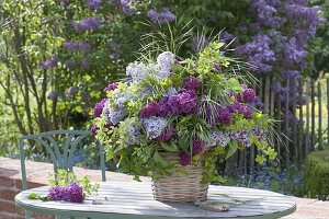 Bouquet of syringa, branches of Rose, akebia