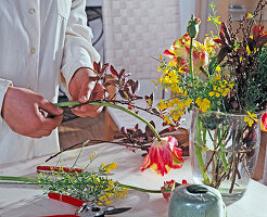 Tulips, cytisus and viburnum bouquet binding