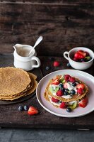 Coconut and courgette pancakes with fruits and vanilla cream