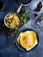 Potato and cauliflower curry with bean pancakes (India)