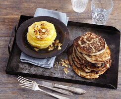 Vegan banana and coconut pancakes with almond-topped pineapple rings