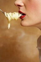 Woman Being Fed Pasta