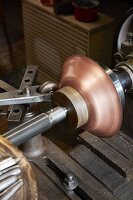 Copper sheet being formed at the Kupfermanufaktur Weyersberg copper factory in Baden-Württemberg, Germany