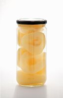 Preserved pear halves in a jar