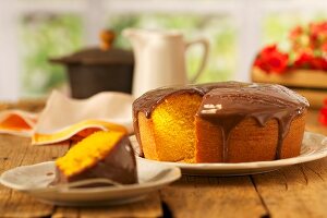 Maize cake with a chocolate sauce topping on the afternoon tea table