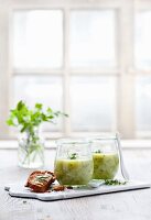 Herb and potato soup in glasses