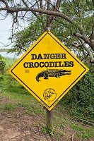 A sign warning of crocodiles in the iSimangaliso Wetland Park, a wildlife park in South Africa