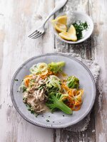 Veal strips in a creamy mushroom sauce with broccoli and carrot noodles