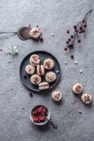 Raw coconut macarons with strawberry filling