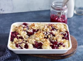 Rice pudding and cherry bake with coconut flakes