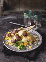 Beef skewers on a bed of couscous