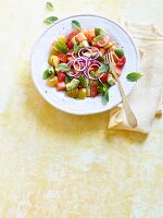 Rainbow tomato and melon salad with avocado