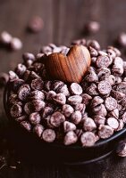 Wooden heart on chocolate chips