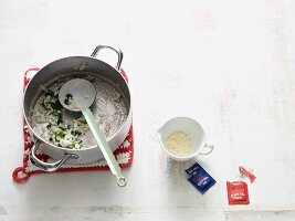 A pan with leftover spinach rice