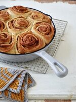 Danish cinnamon rolls in an enamel pan