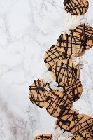 Chocolate biscuits with coconut shavings