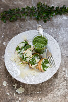 Baked potatoes with pesto and Parmesan cheese