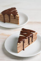 Two pieces of Mille Crepes cake (pancake cake) with chocolate