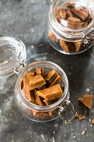 Caramel sweets with fleur de sel in jars