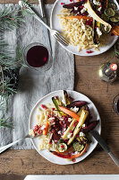 Spätzle (soft egg noodles from Swabia) with roasted vegetables, gravy, almond feta cheese and pomegranate seeds (vegan)