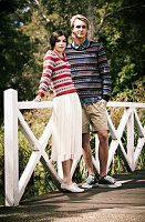 A young couple on a bridge