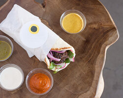 Falafel pita with various sauces (seen from above)