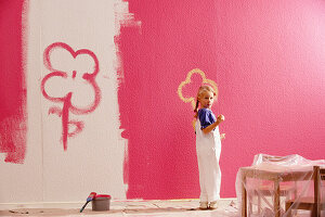 A girl painting a bedroom