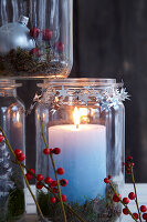 Pyramid of festive mason-jar candle lanterns (close-up)