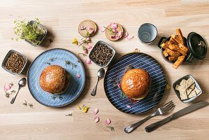 Mealworm burgers – buns with a veggie patty and worms served with sweet potato chips