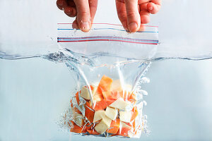 Food being dip vacuum packed