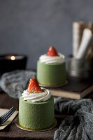 Mini matcha cakes with cream and strawberries