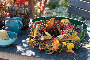 Autumn wreath with crab apples, rose hips and privet berries