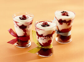 Dessert with stewed raspberries, blackberries, blueberries, redcurrants, blackcurrants mixed with yoghurt