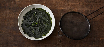 Dried wakame being softened in water