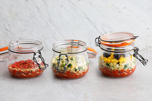 Soup being layered in a jar