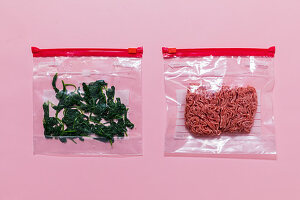 Minced meat and spinach leaves being frozen