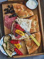 Stuffed unleavened bread with antipasti