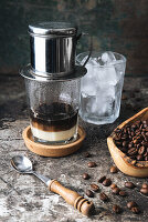 Freshly brewed coffee, ice cubes and coffee beans