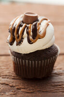 Chocolate cupcake with icing and chocolate on the top